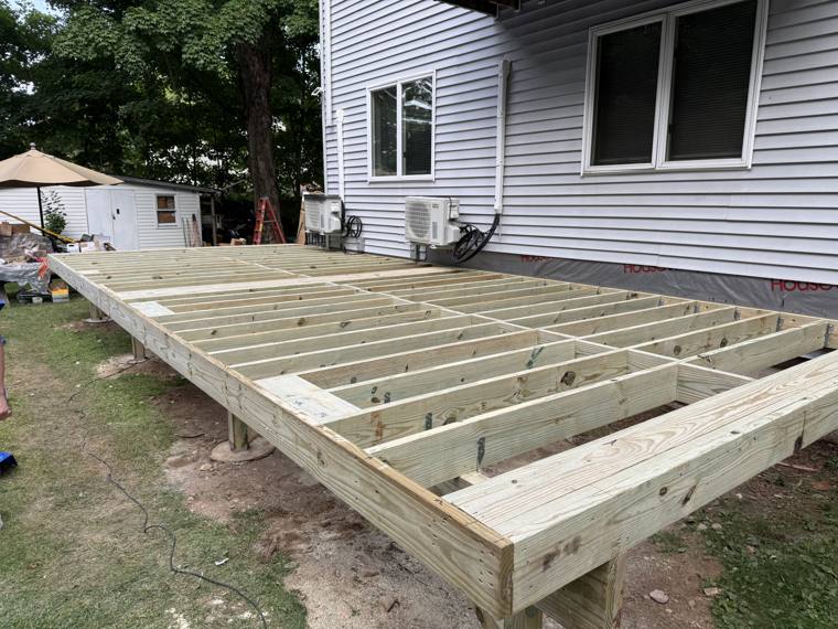 Pressure-treated deck floor framing