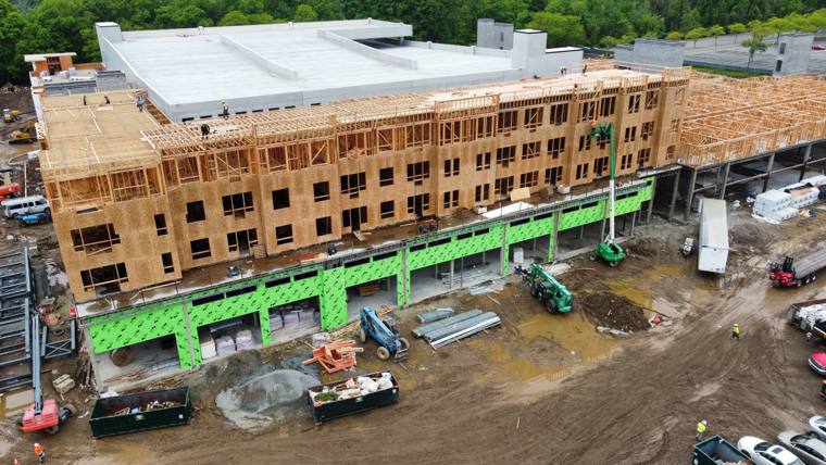 Long multi-story wood-frame building, aerial