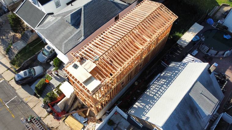 Aerial view of narrow-lot home roof framing