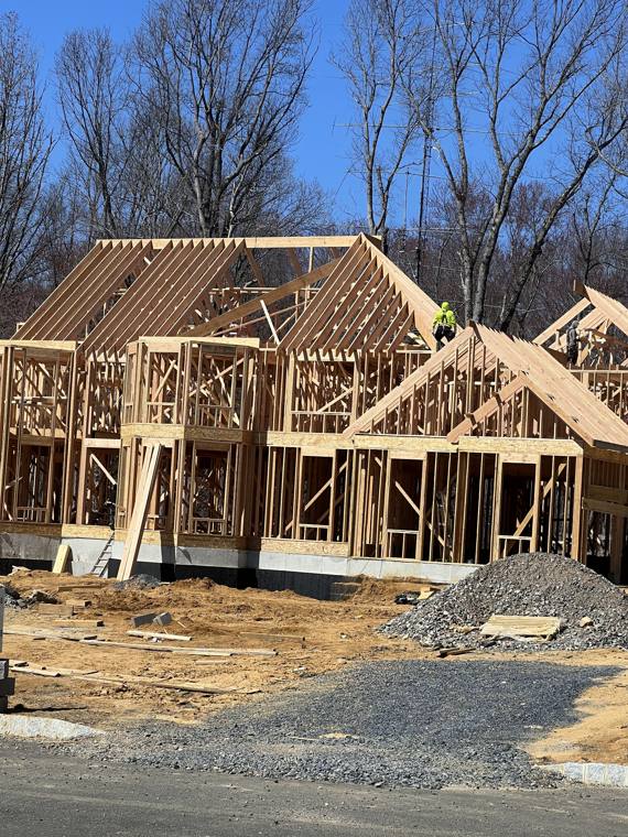 New home with walls and roof framing up