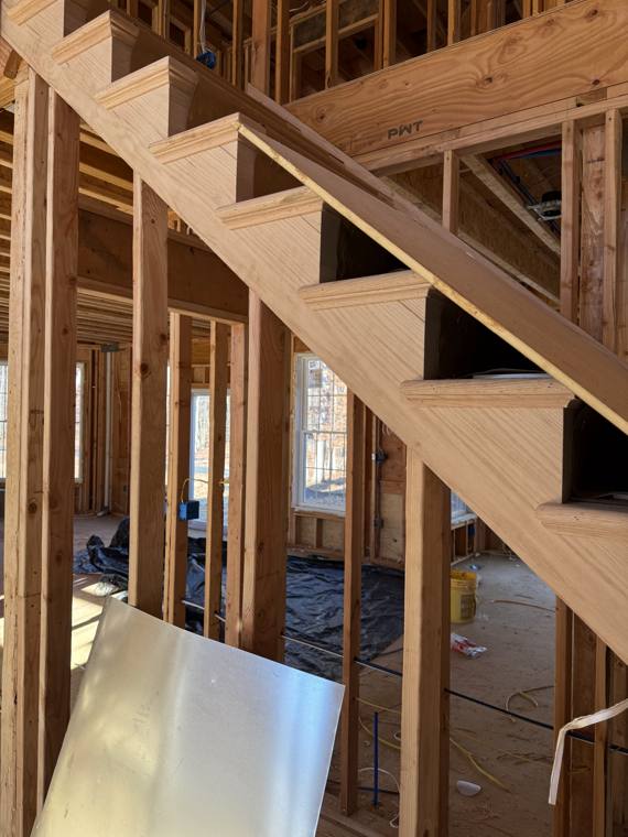 Open staircase framed inside a new home