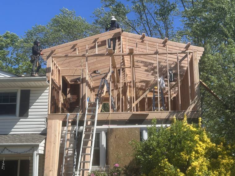 Crew framing second-story addition walls