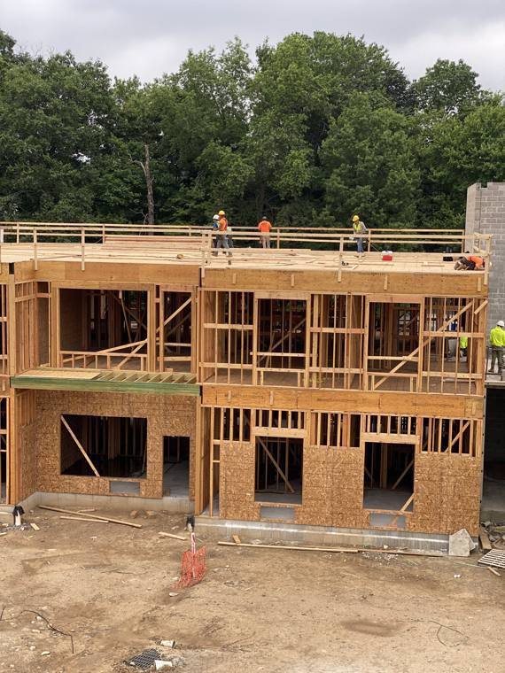 Two-story townhome framing around a courtyard