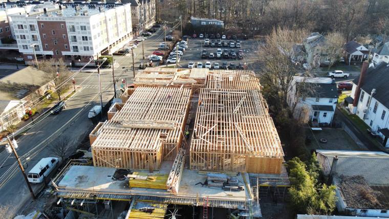 Aerial view of townhome rows being framed